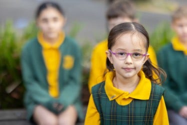 Kindergarten girl student in playground.